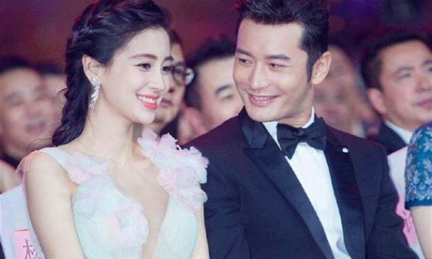 离婚两年后同框 晓明Angelababy带儿子游迪士尼